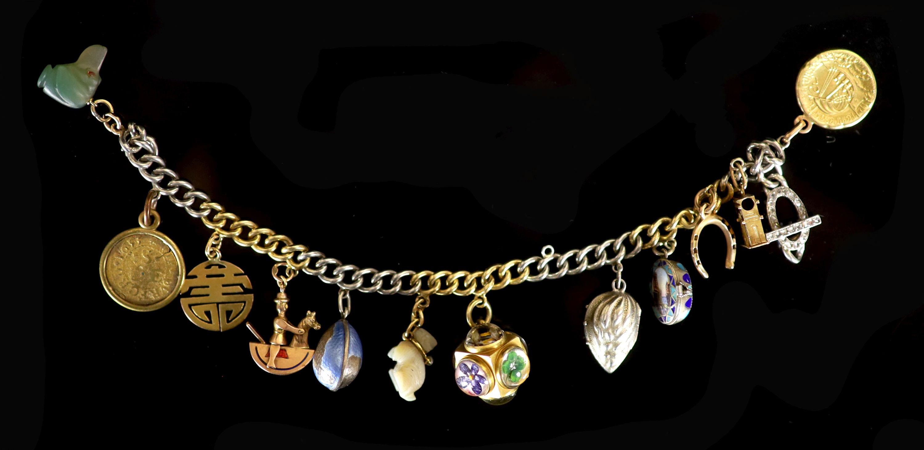 A platinum and gold curb link charm bracelet, hung with twelve assorted charms